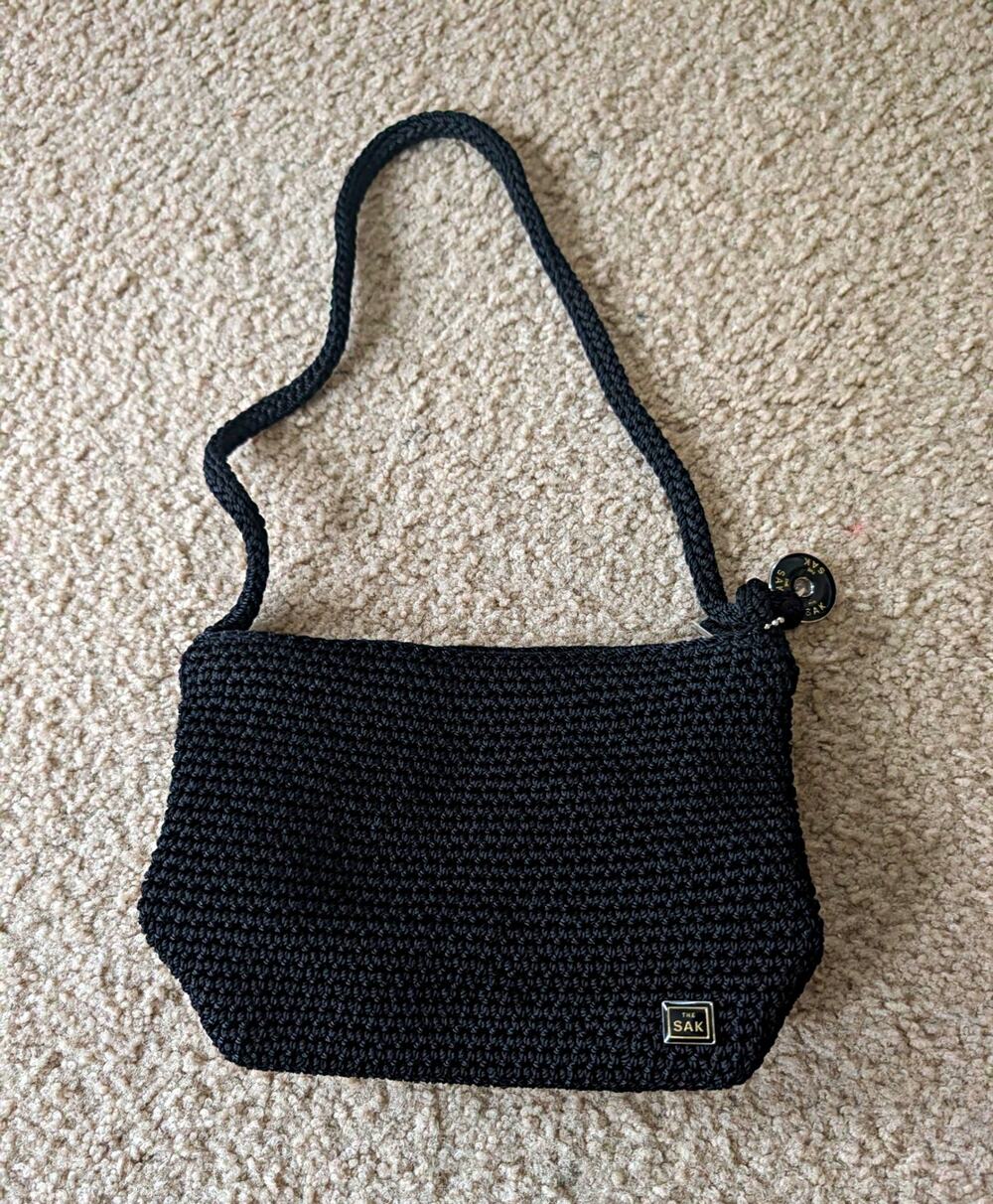 The Sak Black Crochet Shoulder Bag with Logo Charm & Silver Hardware Small